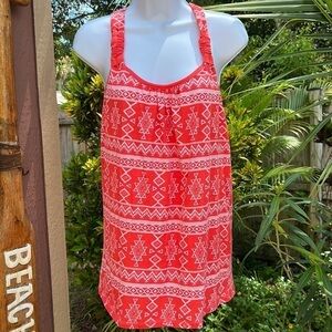 104. Poof A fun orange and white top. Straps come together and back in a Y shape